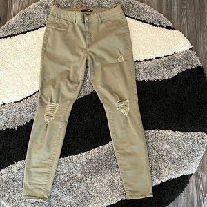Mid waist olive ripped jean. Size 10